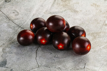 Raw ripe black kumato tomato