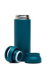 Close-up of blue reusable steel stainless eco thermo water bottle with opened cap isolated on a white background with clipping path. Zero waste, Plastic disposable bottles. Environment concept.