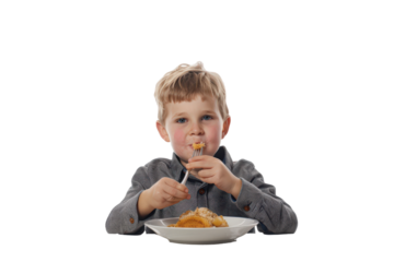 Boy happily eating a meal with joy