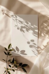 Serene Shadows: Blank Paper Canvas Surrounded by Natural Leaf Silhouettes