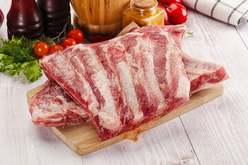 Raw pork ribs over board
