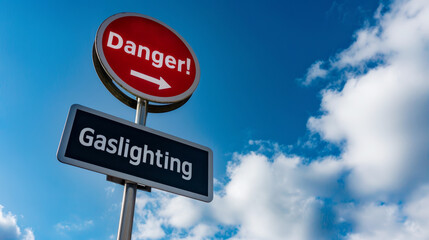 Danger Gaslighting red against blue sky background with copy space for text. Psychological abuse and manipulation in toxic relationships with a narcissist partner concept