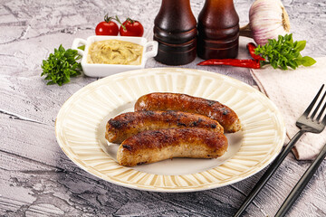 Delicous natural roasted sausages in the plate
