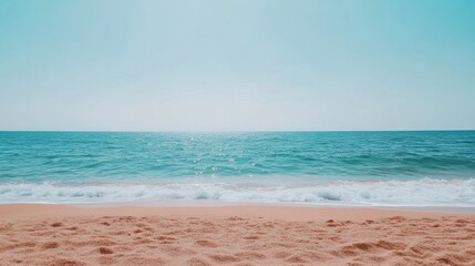 Obraz premium Serene beachscape with clear blue sky gentle waves