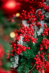 close-up of a Christmas tree with red berries, Christmas decorations