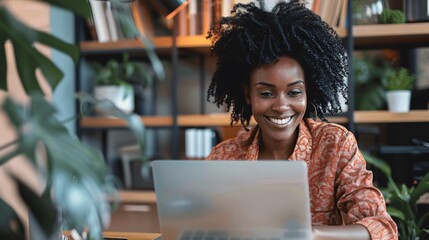 Happy African American Woman Working on Laptop in Office
