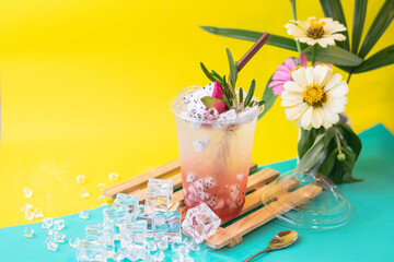 Dragon fruit and strawberries are flavored and blended into a drink.