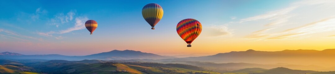 Naklejka premium Colorful balloons floating in the sky over beautiful landscapes symbolizing freedom and adventure