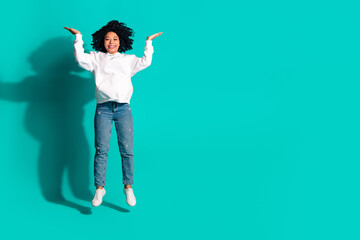 Photo portrait of young funny chevelure hairstyle lady jumping with two hands raised up isolated on...