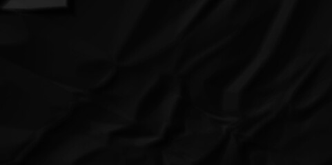 Dark black crumpled paper texture background. black crumpled and top view textures can be used for background of text or any contents.