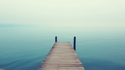 Fototapeta premium Wooden Dock Leading to Tranquil Lake