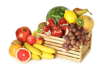 Wooden crate with many different fresh fruits isolated on white