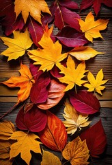 Obraz premium vibrant autumn leaves scattered rustic wooden background creating colorful natural display, colors, nature, foliage, textures, season, orange, yellow, brown
