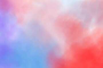 Dramatic smoke and fog in contrasting vivid red, blue, and purple colors. Vivid and intense abstract background or wallpaper