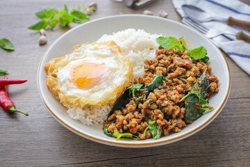 Homemade Rice topped with stir fried Thai basil with minced pork and fried egg, pad ka praow moo sap