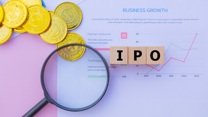 Wooden cube with the word IPO. It is an abbreviation of Initial Public Offering. Business...