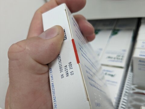 Prague,Czech Republic-September 4 2024: medicine box. Falsified Medicines Directive. FMD. Unique identifier and an anti-tampering device on drug. Medicine box and blister closeup-macro,technology