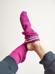Knitted socks on feet