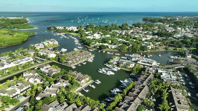 Aerial view: luxury yachts and apartments in La Balise Marina, Mauritius island