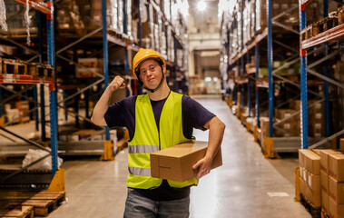 Proud Warehouse Worker with Down Syndrome Carrying Box in Aisle
