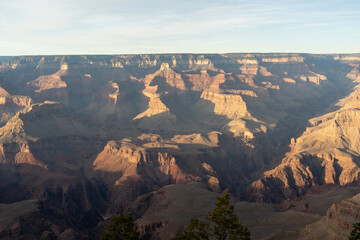 A stunning sunset view of the red rocks at Grand Canyon National Park, Arizona.