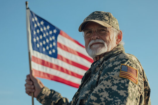 American veteran proudly holding the united states flag on a bright sunny day