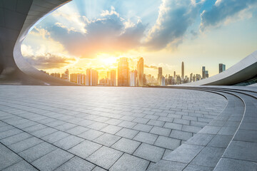Empty square floor and city skyline with modern buildings scenery at sunrise in Shenzhen. car advertising background.