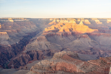 A stunning sunset view of the red rocks at Grand Canyon National Park, Arizona.