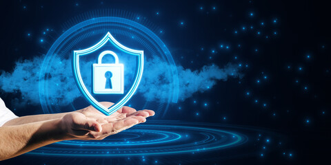 Close up of businessman hands holding glowing padlock and shield on cloud hologram. Blurry blue background. Secure and protection concept.