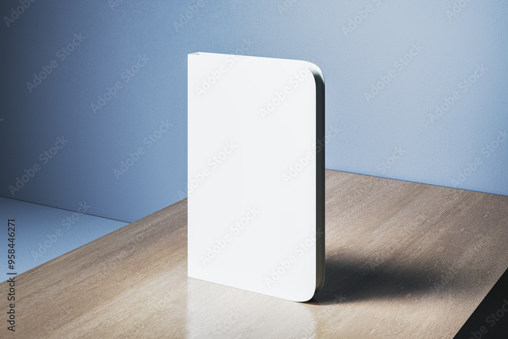 Poster empty closed white notebook with mock up place on wooden desk and concrete wall background backgroun