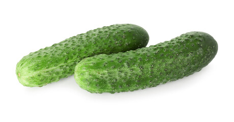 Two whole fresh green cucumbers isolated on white