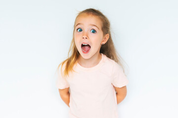 Cute girl 4-5 year old posing in studio