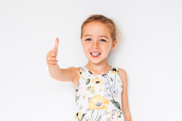 Cute girl 4-5 year old posing in studio