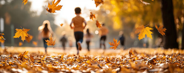 Children running through a path covered in autumn leaves, capturing the essence of fall and playful outdoor activity.