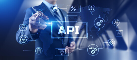 API Application programming interface. Businessman pressing virtual button.