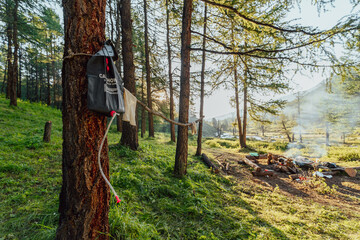 portable compact camping shower in summer morning forest