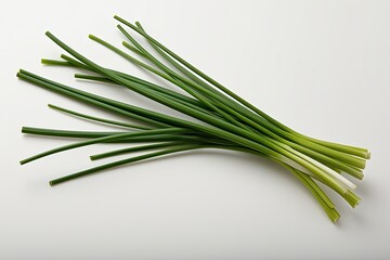 Fototapeta premium Fresh Green Chive Stalk Isolated on Bright White Background for Culinary Use
