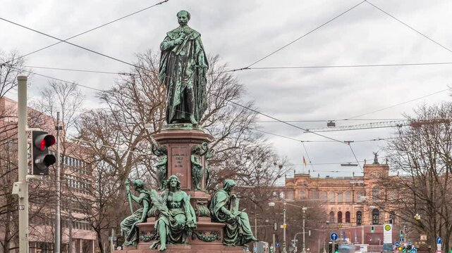 Maxmonument, Monument of Maximilian II of Bavaria timelapse, Maximilianstrasse street, Munich, Bavaria, Germany, Europe. Traffic on the road with tram rails. Maximilianeum building on a background