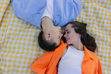 Intimate moment of a lesbian couple enjoying a city park