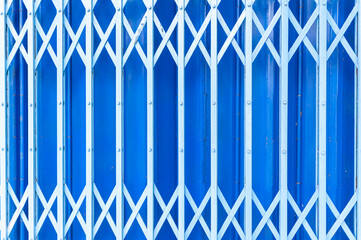 A striking blue background featuring a pattern of white diagonal lines and metal bars, ideal for...