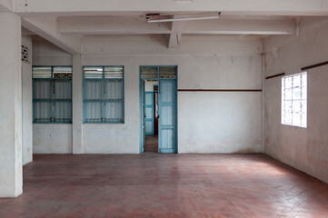 Fototapeta premium Spacious empty room with white walls and blue doors, perfect for various creative projects or interior design inspiration.