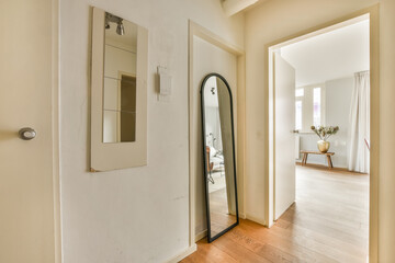 Interior view of a modern home with hallway and mirror