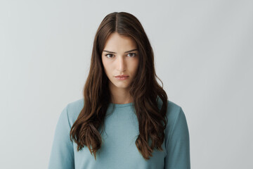 Confident young woman staring at camera