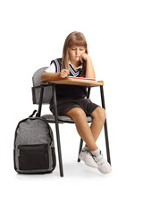 Fototapeta premium Girl in a school uniform sitting in a chair and writing