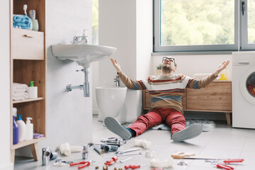 Frustrated man unable to repair his sink