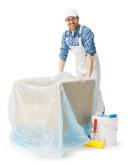 Professional painter covering furniture with a dust sheet © StockPhotoPro