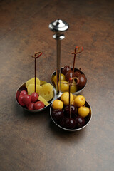 Pickled fruits and berries served as snack
