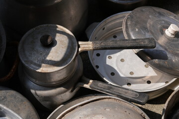 Many unused aluminum cooking pots