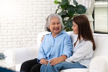 A young woman shares a heartfelt conversation with her mother on a special day, their bond evident in the warmth and affection they express toward each other.