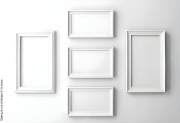 Three white picture frames on a white wall.